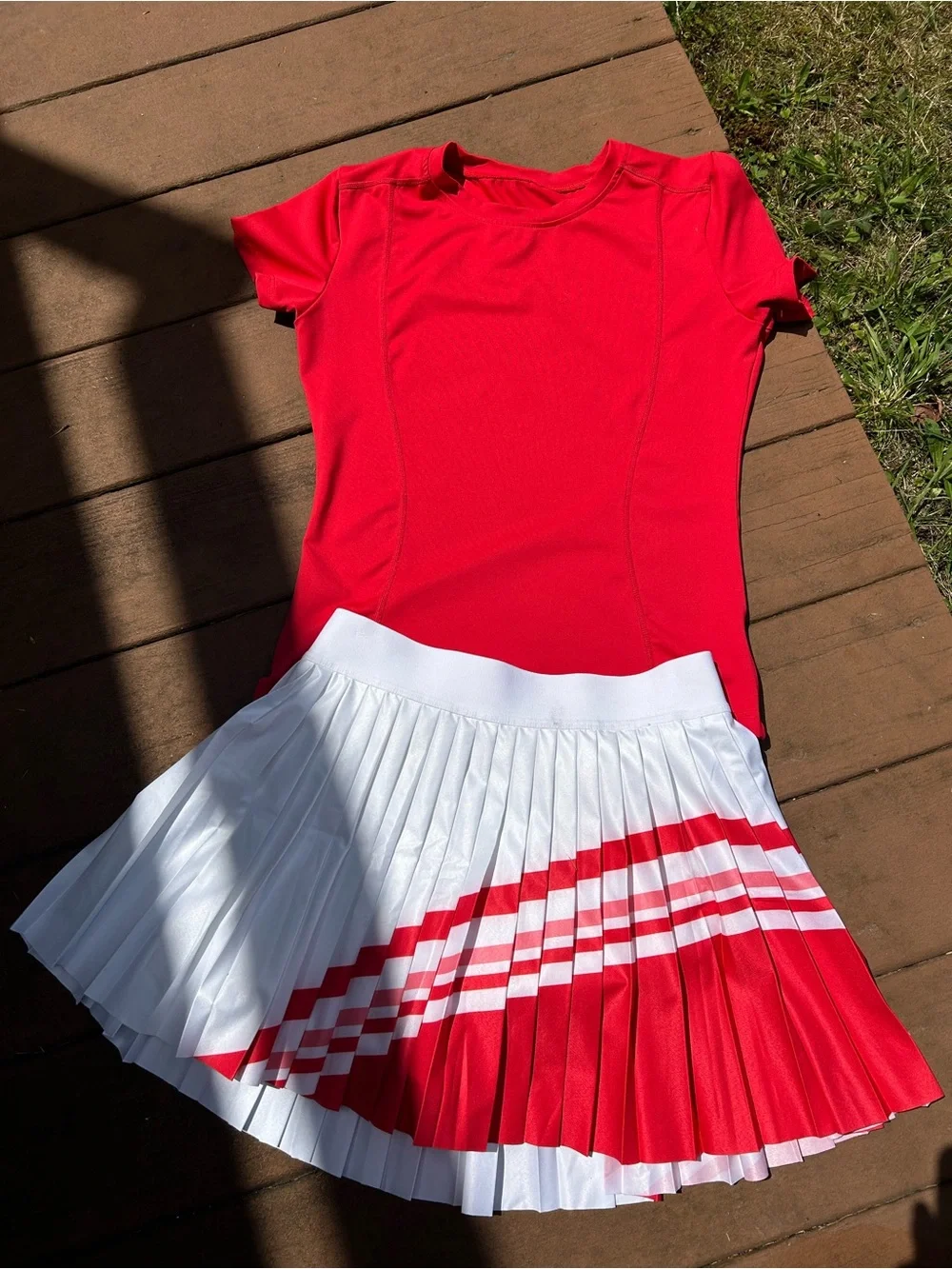 Red Athletic Shirt with White Pleated Athleta Skirt